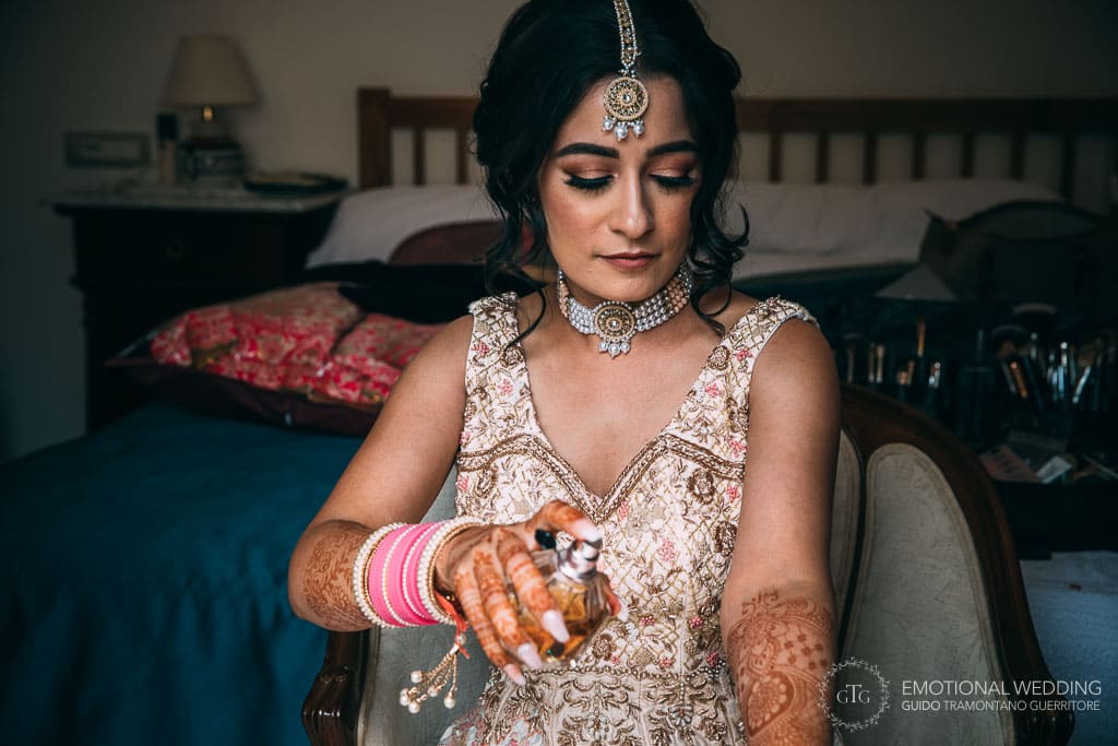 indian bride wearing fragrance at a wedding in ravello