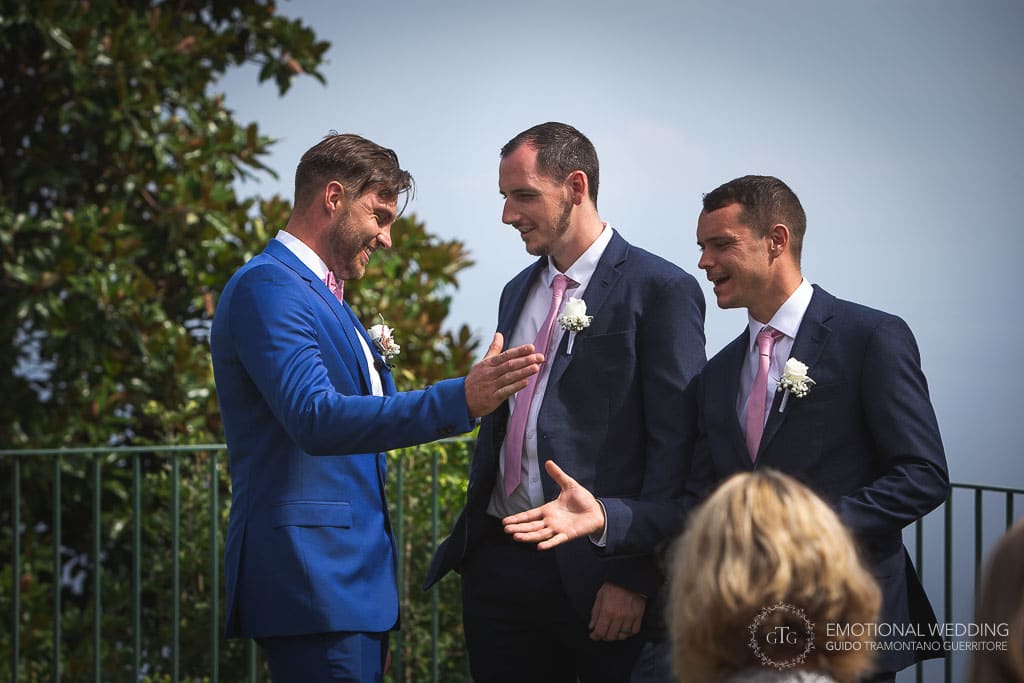 groom and best man shaking hands at a wedding ceremony in ravello