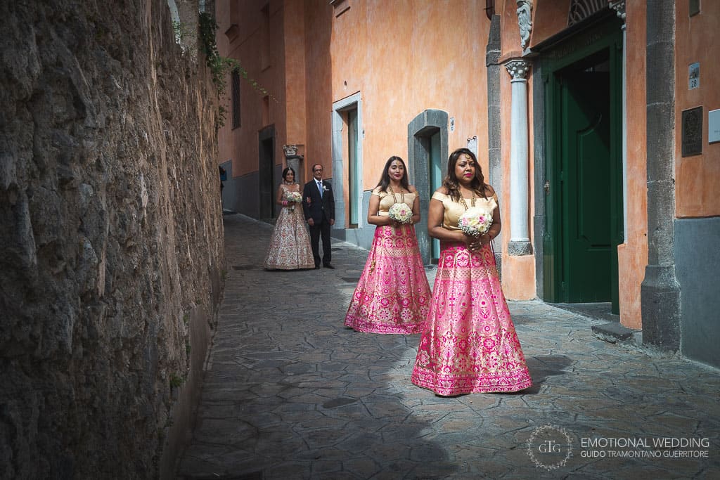 hindu bride and father and bridesmaids walking in ravello