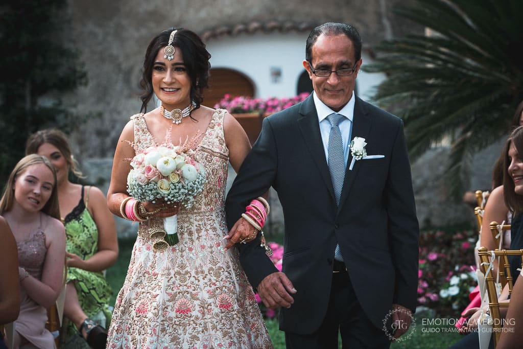 hindu bride and father going to wedding ceremony in ravello