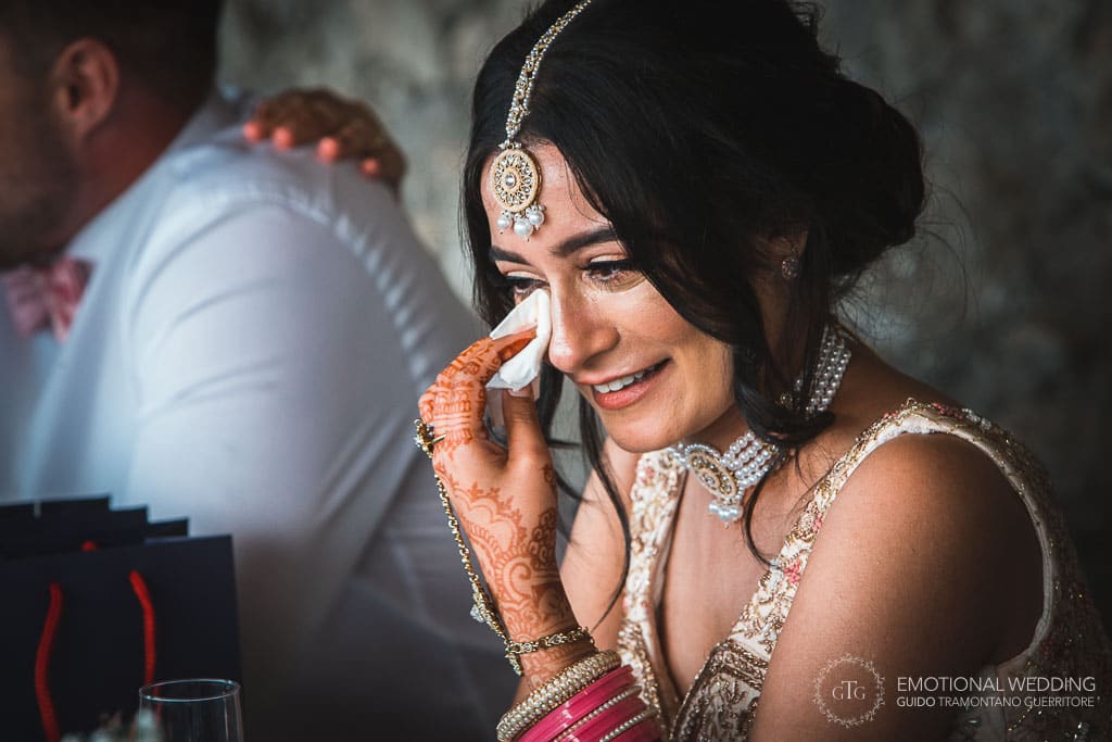 hindu bride wipes tears after a speech at a wedding in ravello