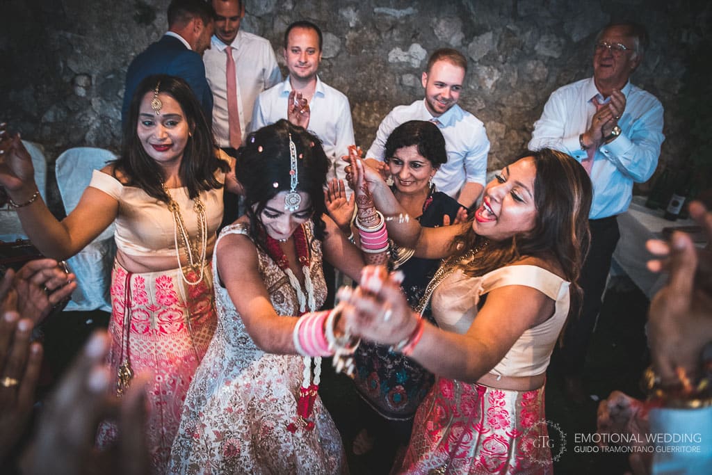 hindu bride and bridesmaids dancing at a wedding party in ravello