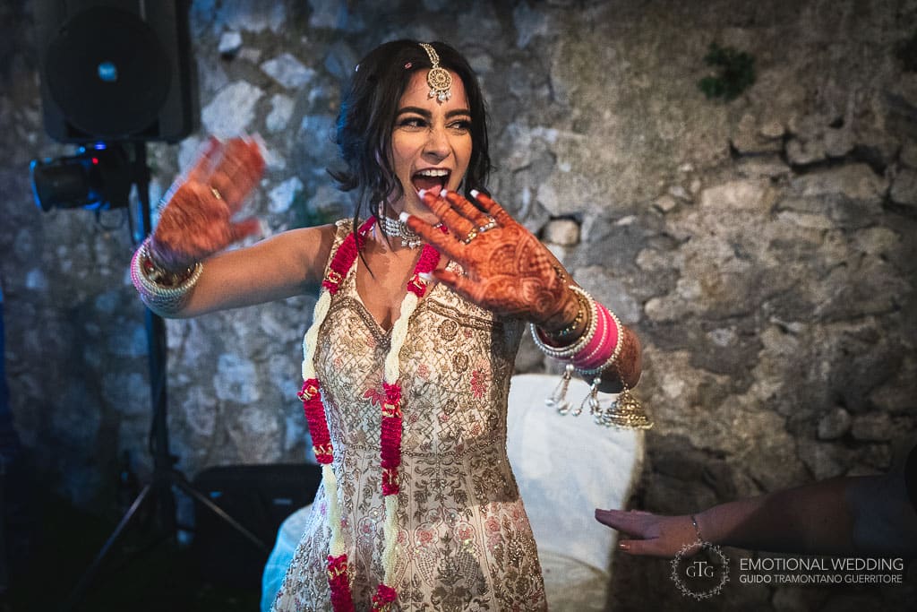 funny expression of indian bride at a wedding party in Ravello