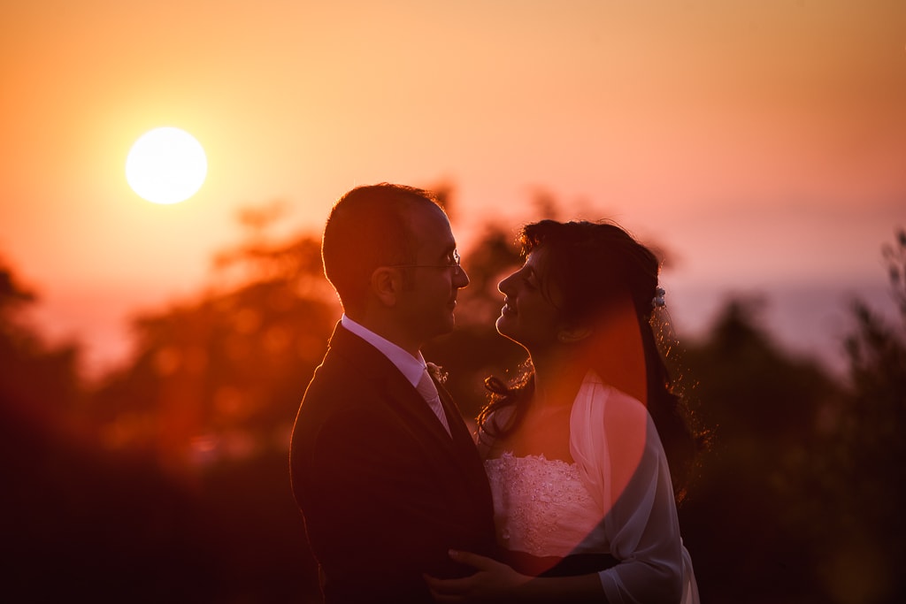 silhouette of a wedding couple at sunset