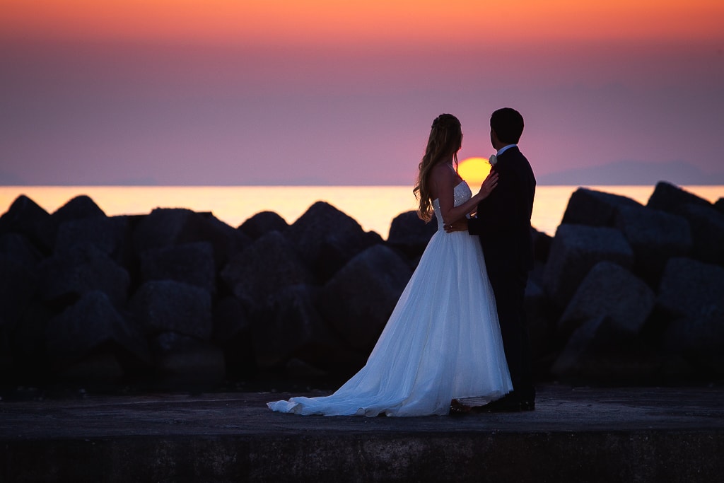 wedding couple enjoying a stunning sunset in cilento, italy