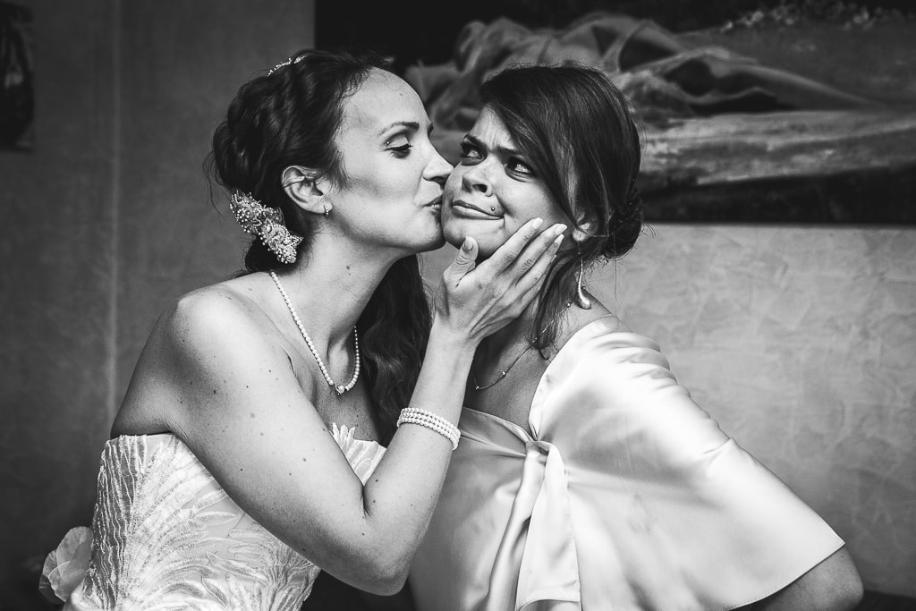 a bride kisses a friend
