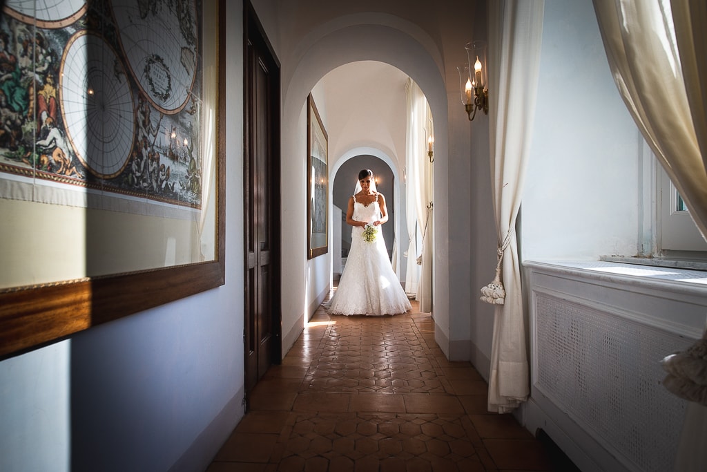 bride walking in the corridor of hotel caruso in ravello amalfi coast