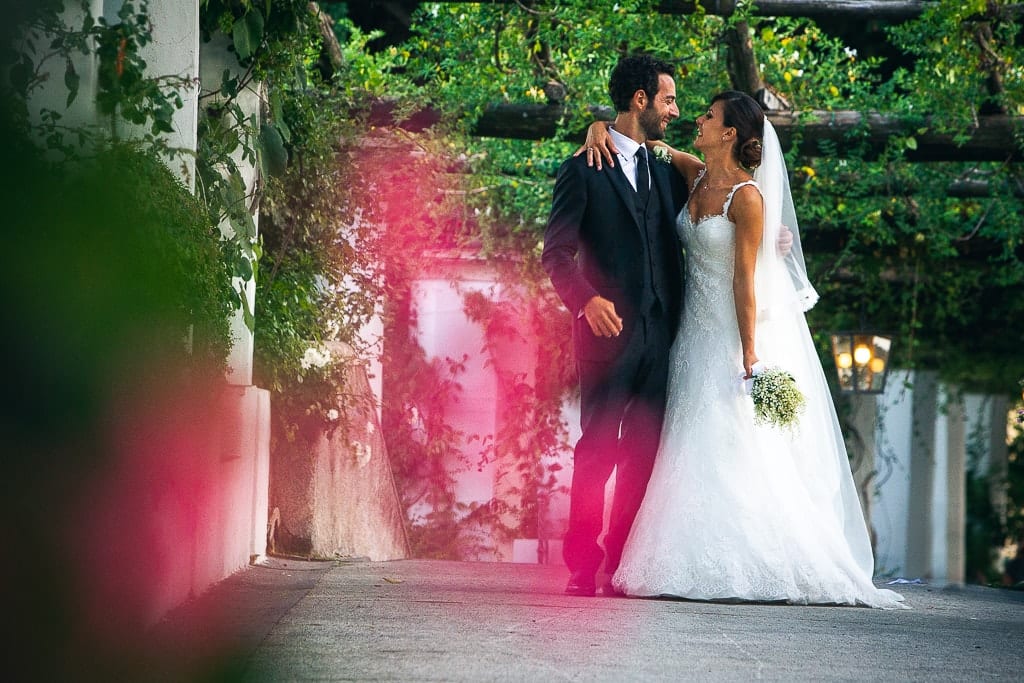 wedding couple in the gardens of hotel caruso in amalfi coast