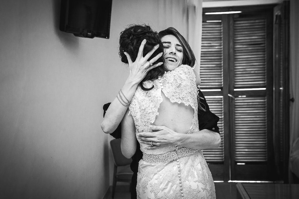 bride and a friend hugging
