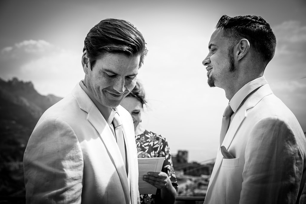 gay couple and celebrant at an open-air ceremony in amalfi coast
