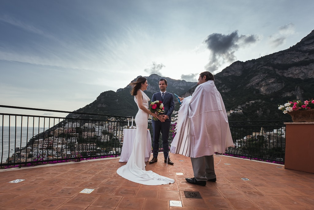 jewish wedding ceremony on a terrace overlooking positano in amalfi coast