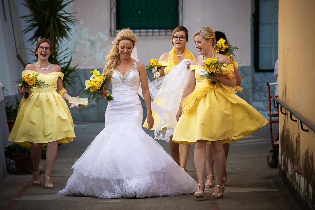 bride and bridesmaids approaching the church in praiano amalfi coast