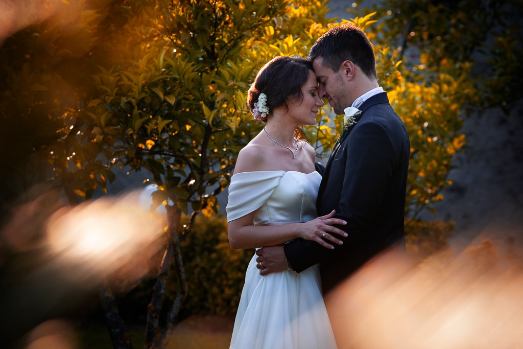 wedding couple tenderness in a warm light at sunset