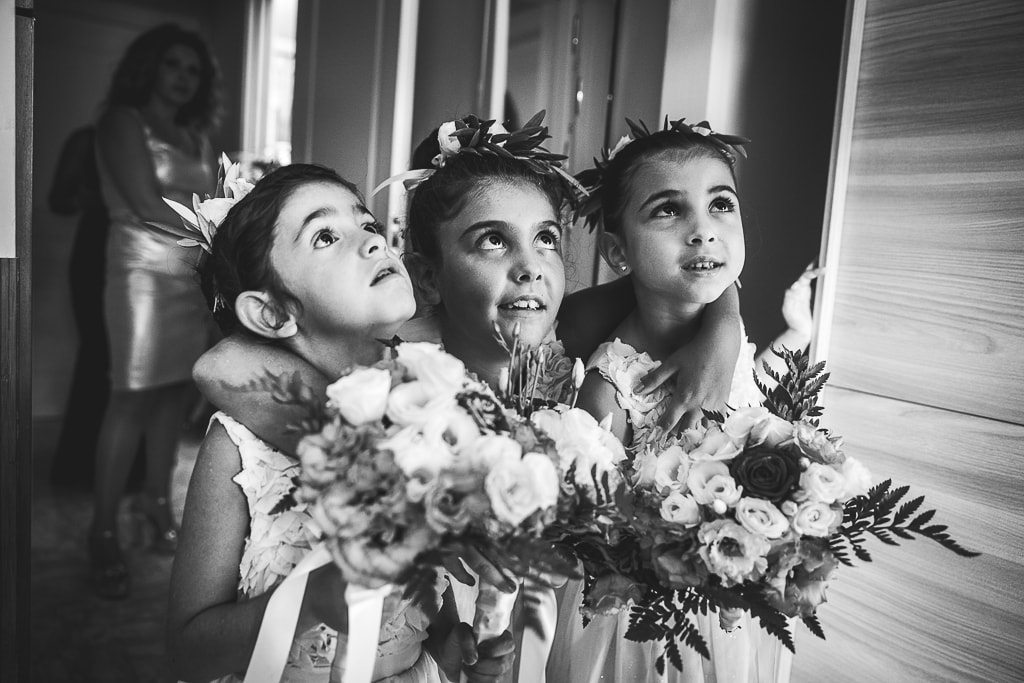 flower girls amazed looking at the bride