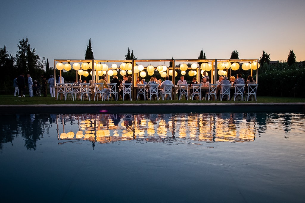 reflection of a wedding reception table setup at dusk in tuscany