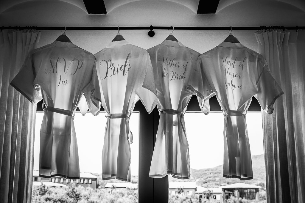 personalized wedding dressing gowns hanged at the window