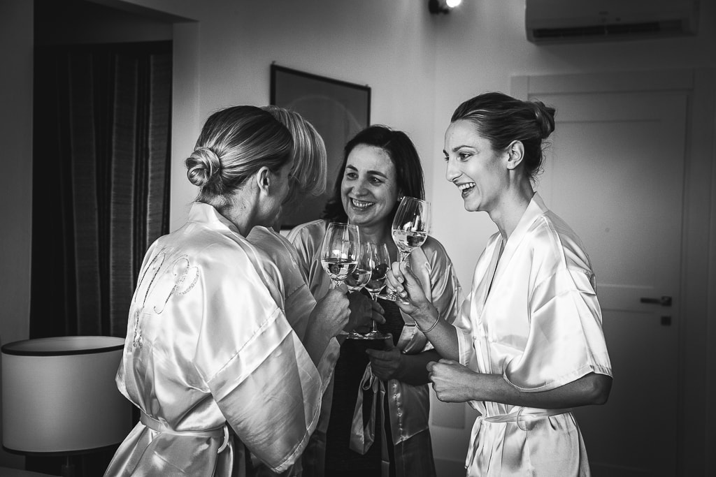 bride and bridesmaids toast