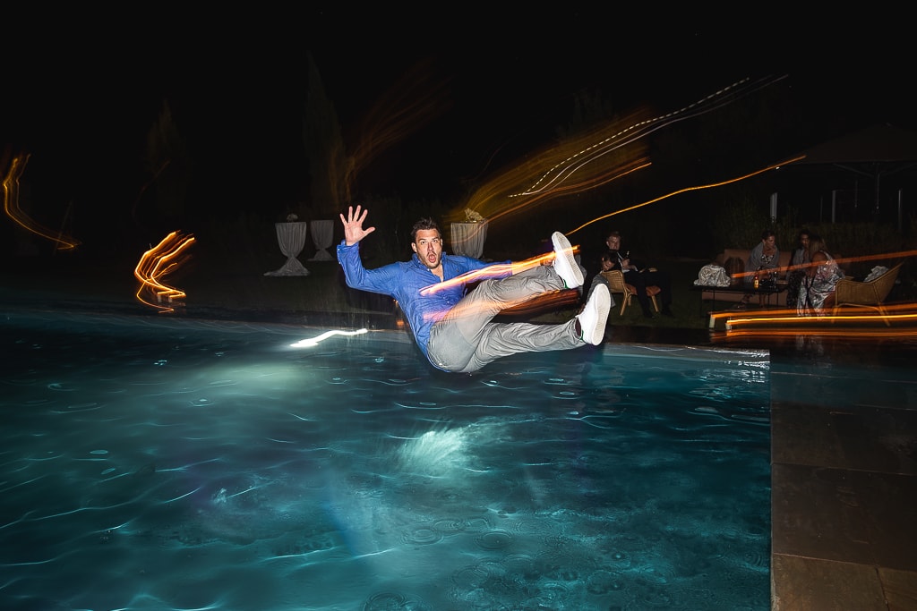 a guest at a wedding falling into the pool