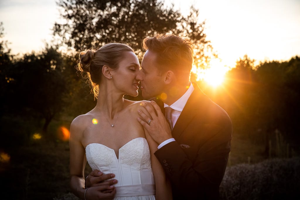 wedding couple portrait at sunset in tuscany countryside