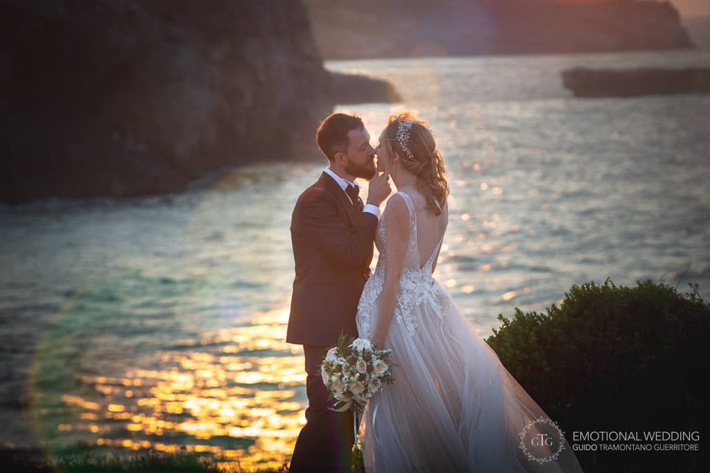 wedding couple romantic kiss in puglia at sunset
