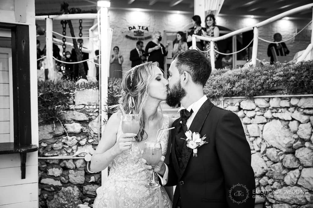 bride and groom kiss at a wedding in puglia
