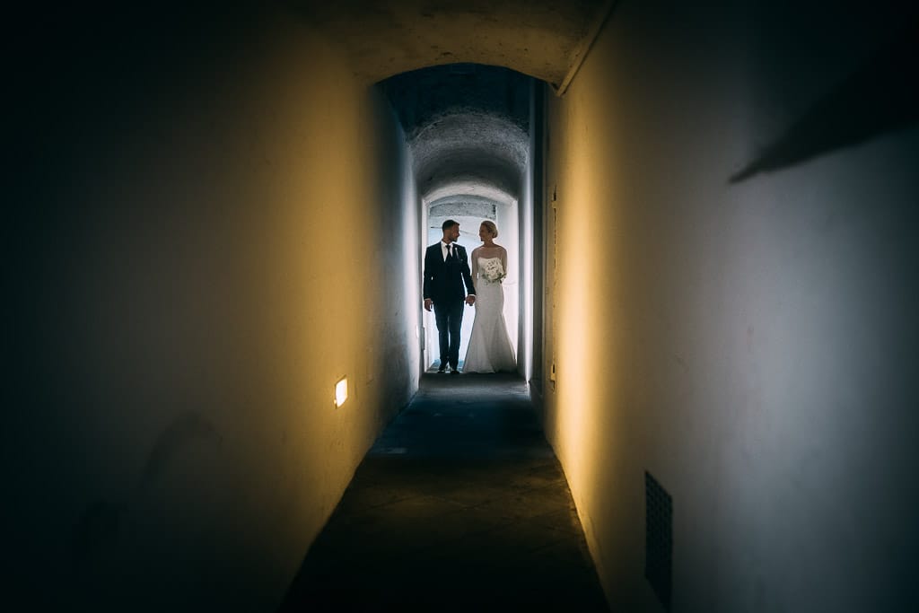 wedding couple walking narrow alleway in amalfi coast