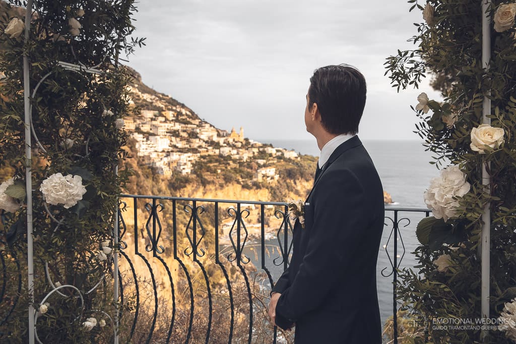 groom and view of praiano in amalfi coast