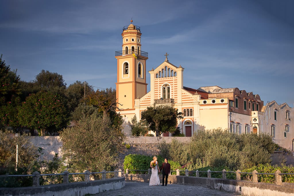 wedding couple walking at san pancrazio church in amalfi coast