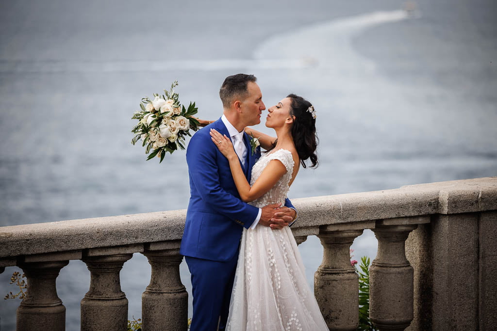 wedding couple on a terrace in sorrento overlooking the sea