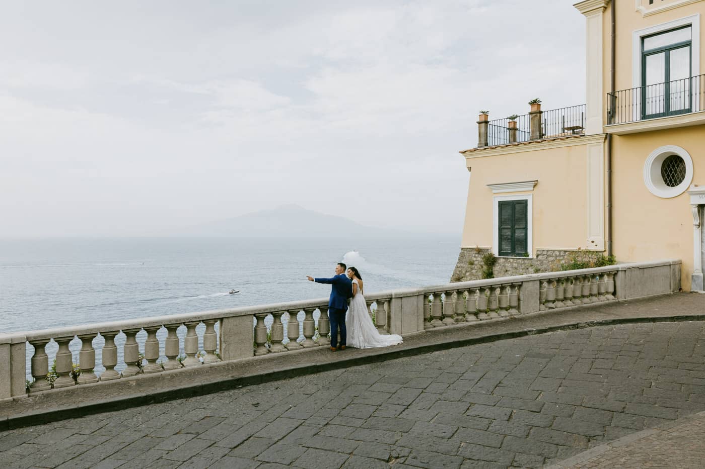 Bride and groom enjoying the breathtaking coastal view from a panoramic terrace — Best Sorrento wedding venues.