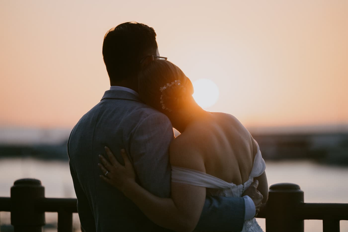 Romantic sunset portrait of a wedding couple seen from behind with vibrant colors — Sorrento wedding sunset photo.