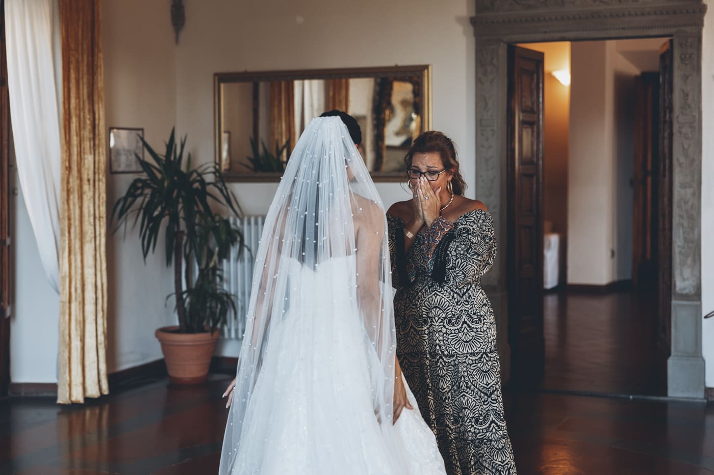 Dark & moody edit with deep shadows, warm highlights, and cinematic contrast enhancing the intimate indoor atmosphere.